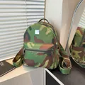 Large capacity camouflage backpack with vintage leopard print elements and metal logo plate - Camouflage