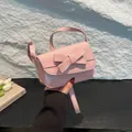 Pink minimalist crossbody bag with decorative bow and patent leather finish for women - Bow Style / Pink