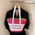 Large striped straw tote bag in pink and white for summer beach vacations and daily use - With Pendant / Pink