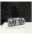 Detailed view of snakeskin pattern texture with black leather handles and silver rivets - One Size / White