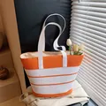 Large orange striped straw tote bag with fabric straps for summer beach vacation - With Pendant / Orange