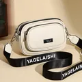 Chic cream crossbody bag with textured leather, triple zippers, and wide logo strap - White