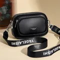 Black litchi pattern leather crossbody bag with wide logo strap and silver hardware - Black