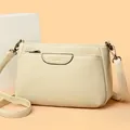 Chic cream-colored crossbody bag with lychee texture and adjustable shoulder strap - One Size / Off White