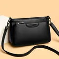 Versatile black crossbody bag in lychee pattern leather with adjustable strap - One Size / Black