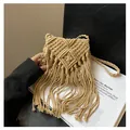 Macro detail of beige handmade macrame bag with long tassels and woven texture - One Size / Khaki