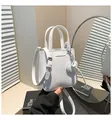 Chic white mini bucket bag with litchi texture leather and silver hardware details - One Size / White
