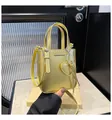 Litchi texture gold bucket bag with 'FASHION & BAGS' text and a heart charm - One Size / Gold