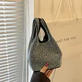 Luxurious black bucket bag with silver rhinestones and a fine metal chain strap - Silver