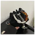 Bolso saco plisado negro con asa de perlas y ámbar y correa de cadena plateada - Talla única / Negro
