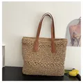 Close-up of woven straw tote bag with brown faux leather handles and hollow detail - One Size / Khaki