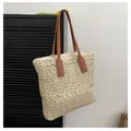 Large beige woven straw tote bag with brown leather handles for summer beach travel - One Size / Off White