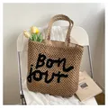 Sac fourre-tout chic en paille ajourée beige avec broderie Bonjour sur chaise blanche - Taille unique / Khaki & Noir