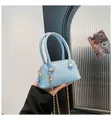 Light blue litchi pattern shell bag with golden ball chain and top handle - Blue