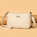 Chic beige crossbody bag with premium lychee grain leather and silver logo detail - Apricot