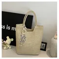 Off-white woven tote bag with evil eye tassel charm and elegant wavy edge detail - One Size / Tote Style (With Tassel) / Off White