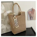 Natural straw woven tote bag with bohemian tassel and evil eye charm in beige color - One Size / Tote Style (With Tassel) / Khaki