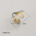 Anillo abierto de corazón bicolor minimalista en acero inoxidable pulido plata y oro - Estilo de Doble Corazón Entrelazado / Bicolor Oro y Plata