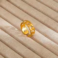 Detailed close-up of gold geometric chain ring set in a soft beige jewelry box - Gold Hollow Geometric Chain Style (36)