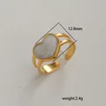 Detail of adjustable gold-finish ring featuring a 12.8mm marble pattern heart inlay - Heart Marble Pattern Style (227) / Gold/White