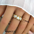 Detail shot of 7.6mm wide gold ring with white heart motifs and 3.2g weight - Continuous Hearts Vintage Ring (229) / 7.6mm