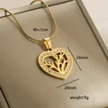 Detail shot of 14k gold plated heart pendant with tree of life design and zircon inlay - Tree of Life Hollow (10-1)
