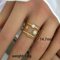 Macro detail of gold celestial ring with moon and stars measuring 14.7mm wide - Vintage Celestial Layered Ring (245) / 14.7mm