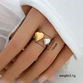 Detail showing 13mm width and 5.1g weight of two-tone heart open ring on finger - Double Heart Open Design (287)