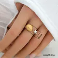 Detail shot of ocean theme ring featuring 10mm golden shell and starfish charms - Scallop Starfish Design (291)
