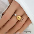 Detail view of open ring with 11.3mm gold ball and silver sphere weighing 5.8g - Double Ball Design (292)