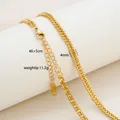 Detail view of 18K gold plated stainless steel curb chain with lobster clasp and extension - Flat Curb Chain Style / Gold