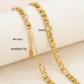 Detailed view of a 6mm wide golden Figaro chain necklace with lobster clasp and extender - Wide Figaro Chain Style / Gold