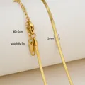 Detail of 2mm gold herringbone chain showing lobster clasp and 40+5cm length specs - Herringbone Snake Chain Style / Gold