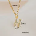 Detail view of gold letter H pendant necklace with dimensions and zircon inlay details - Letter H