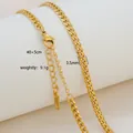 Macro shot of 18K gold plated 3.5mm Cuban chain with lobster clasp and extension - Sleek Curb Chain Style / Gold
