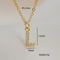 Close-up of golden square letter L necklace with cubic zirconia and size dimensions - L