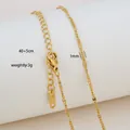 Detail of 18K gold plated stainless steel chain showing lobster clasp and 40+5cm extension - Intertwined Fine Chain Style / Gold