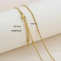 Detailed view of 1mm gold box chain with lobster clasp and 40+5cm extension on a stand - Slim Box Chain Style / Gold