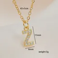 Macro view of gold initial Z pendant with white zircons and detailed dimensions - Letter Z