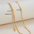 Macro shot of 2.5mm gold 18K plated stainless steel twisted rope chain with 40+5cm length - Twisted Herringbone Chain Style / Gold