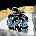 Elegant butterfly hair claw clip with blue rhinestones and black glossy finish - Butterfly Claw / Blue
