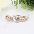 Elegant peacock hair clip with sparkling rhinestones and a golden metallic finish - Peacock White