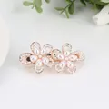 Elegant rose gold spring clip featuring dual flower designs with inlaid pearls - Two Flowers