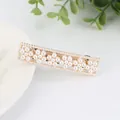 Elegant gold hair clip with white pearls in floral patterns for women's hair styling - Six Flowers Style