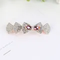 Elegant gold hair clip with sparkling white rhinestones and purple gemstone bow - Purple Bow
