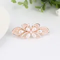 Elegant gold butterfly hair clip adorned with white pearls and rhinestones - Lotus