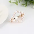 Elegant gold heart hair clip featuring white pearls for a vintage aesthetic look - Rhombus Hollow