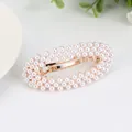 Elegant gold oval hair clip with rows of white pearls and spring closure for women - Ellipse
