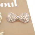Elegant white pearl hair clip with rhinestones and gold bow design for bridal styling - Big Bow White