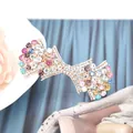 Eleganter goldener Haarclip mit lila, rosa und blauen Kristallen in Schleifenform für Damen - Fächer